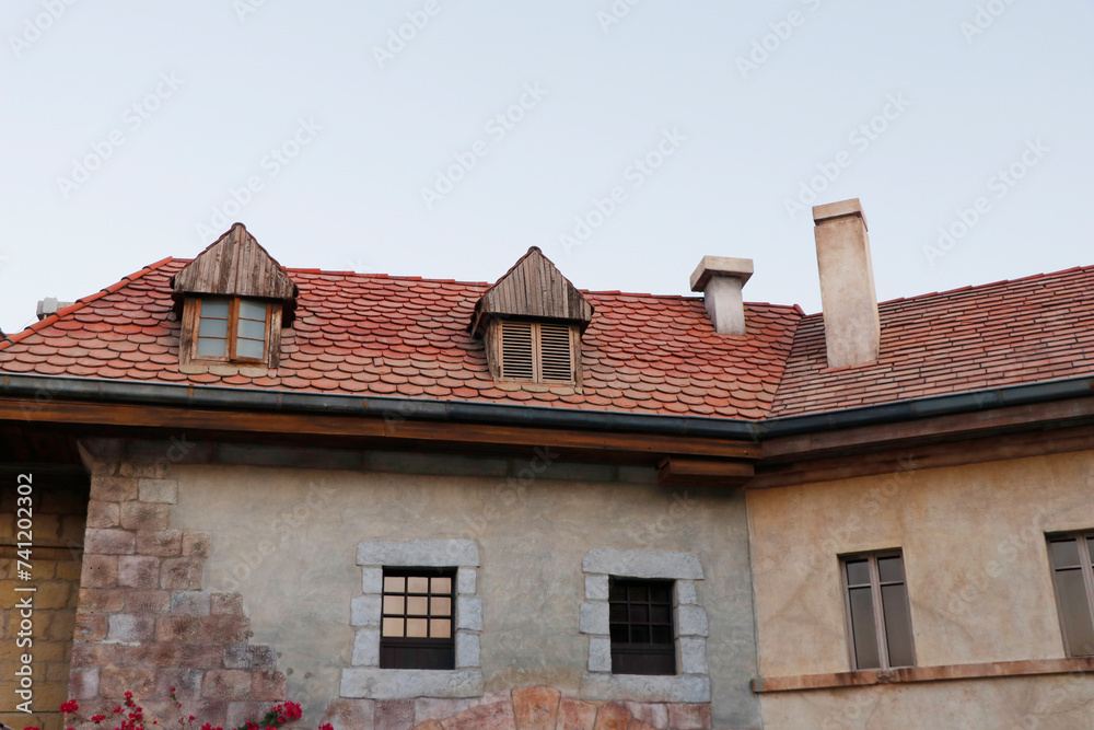 Old french european style traditional stone cottages, villas or houses, classic roof and brick work