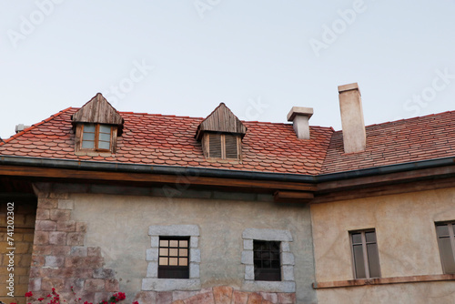 Old french european style traditional stone cottages, villas or houses, classic roof and brick work