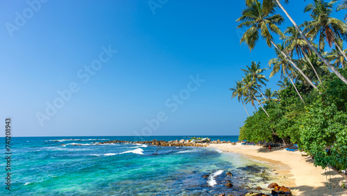 Fototapeta Naklejka Na Ścianę i Meble -  Beautiful Indian Ocean coastline on the island of Sri Lanka, Mirissa.