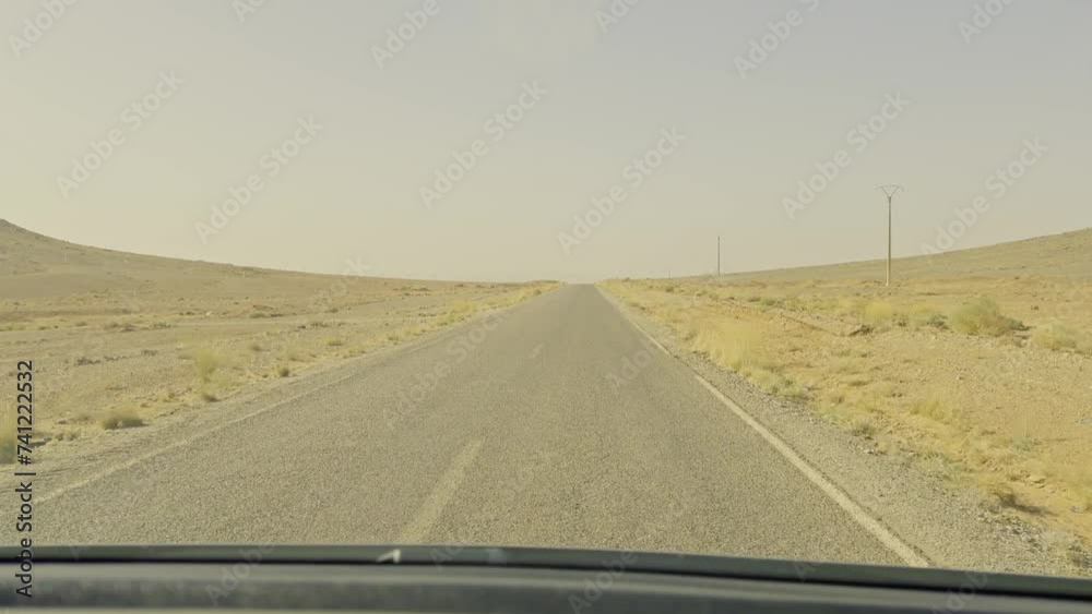 POV of a caravan traveling on a straight desert road in Merzouga in Morocco POV of a caravan traveling on a straight desert road in Merzouga in Morocco