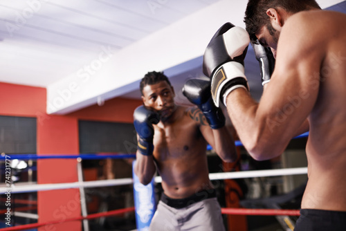 Men, boxing ring and gloves for fight competition in gym for challenge practice as opponents for workout, exercise or winner. Male people, punch and athlete progress for battle, performance or cardio