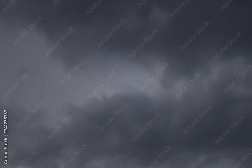 Overcast sky with dark clouds. Dark sky before a thunder-storm. The gray cloud background before rain. Overcast sky with dark clouds. Dark sky before a thunder-storm. The gray cloud background before rain.
