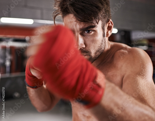 Fototapeta Naklejka Na Ścianę i Meble -  Man, fist and ready for fighting in gym, fitness and topless for exercise and workout. Male person, bodybuilder and punching for challenge or practice, training and martial arts for competition