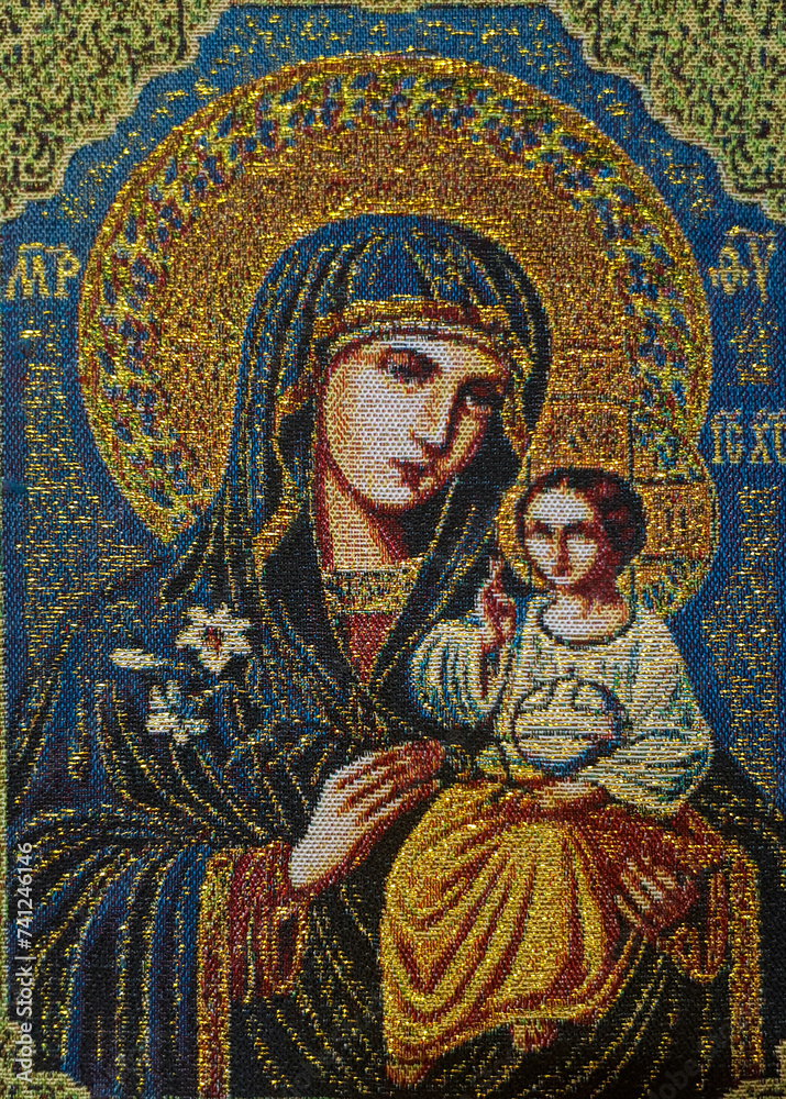 A sewn, embroidered icon representing the Mother of God with the baby Jesus in her arms