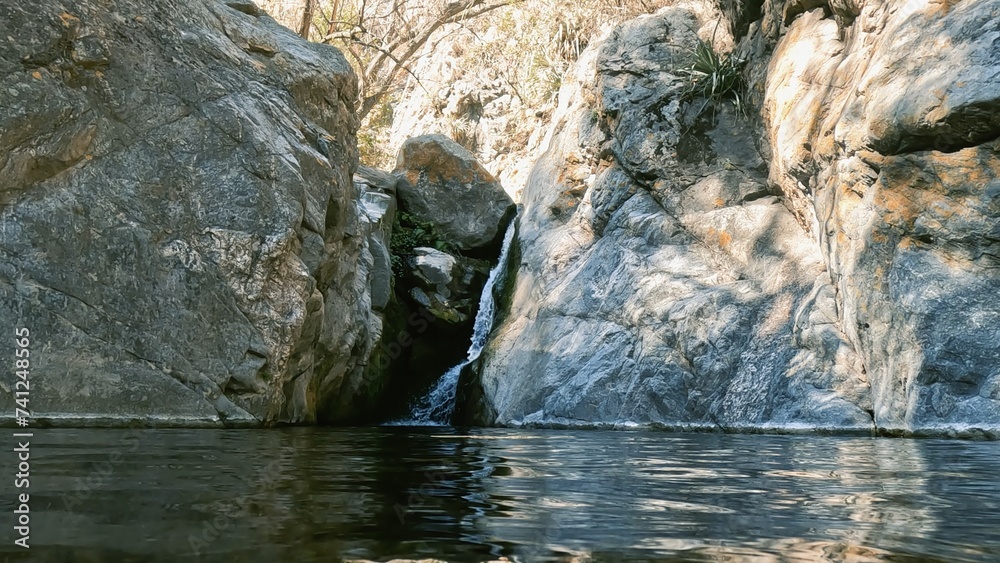 River with rocks and a waterfall in the mountains River with rocks and a waterfall in the mountains