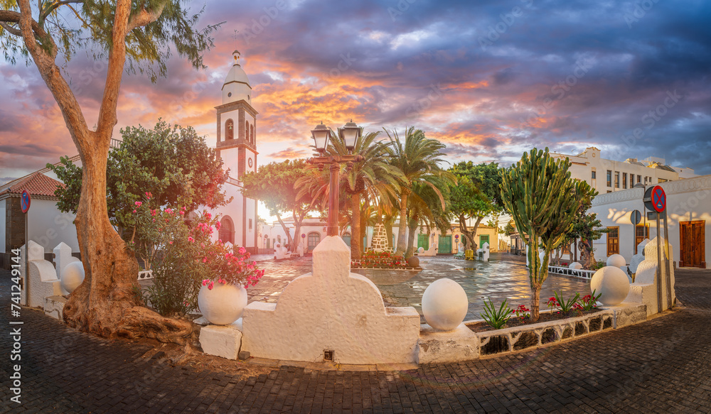 Arrecife charming plaza, bathed in the golden hues of sunset, captures the essence of Lanzarote vibrant yet tranquil island spirit