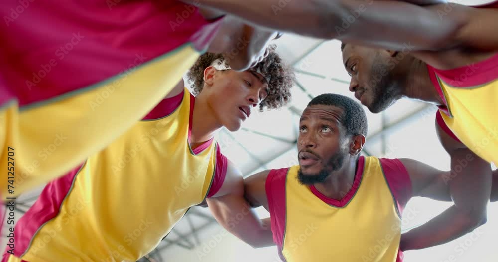 Diverse basketball team in a huddle Diverse basketball team in a huddle