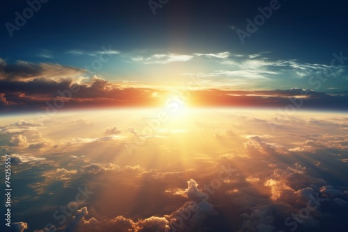 Majestic Sunrise Above Earth's Horizon with Radiant Cloudscape.