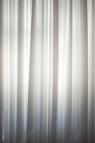 Black and white curtains with a light spot in the middle.