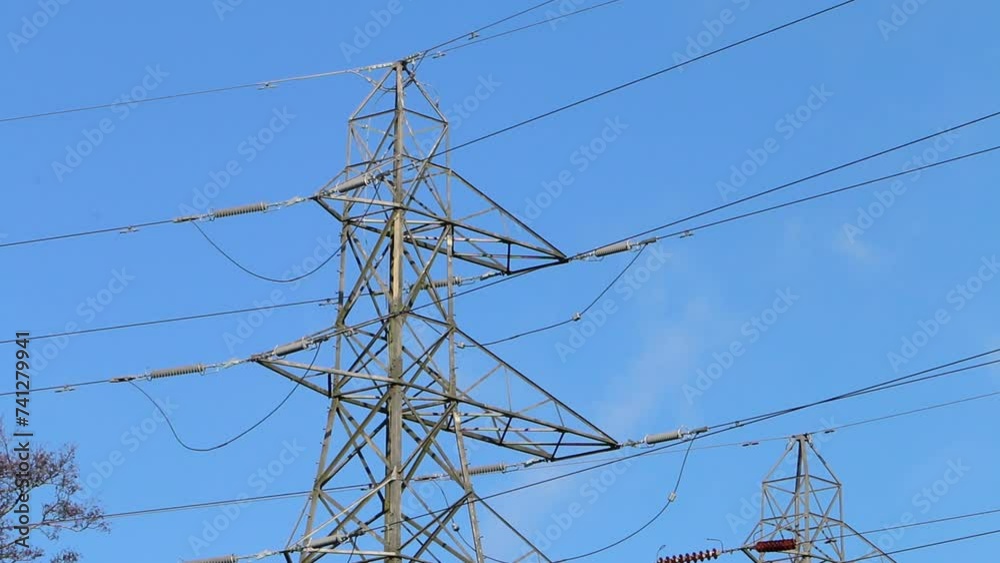 Electricity pylon and wires against a blue sky. Winter. UK Electricity pylon and wires against a blue sky. Winter. UK