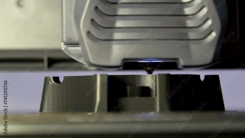 Printing In Slow Motion With A 3D Printer A Black Plastic Piece Printing In Slow Motion With A 3D Printer A Black Plastic Piece