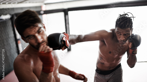 Punch, pain and men sparring for kickboxing competition, challenge and fitness with fight sports in gym. Boxing match, strong fighter and knockout with exercise, practice and power in battle together