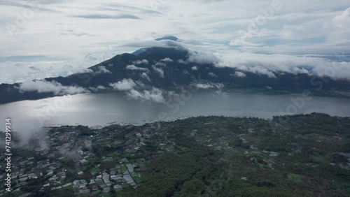 Aerial video of Trunyan hill and Batur lake. Arc right shot. 4K video. photo