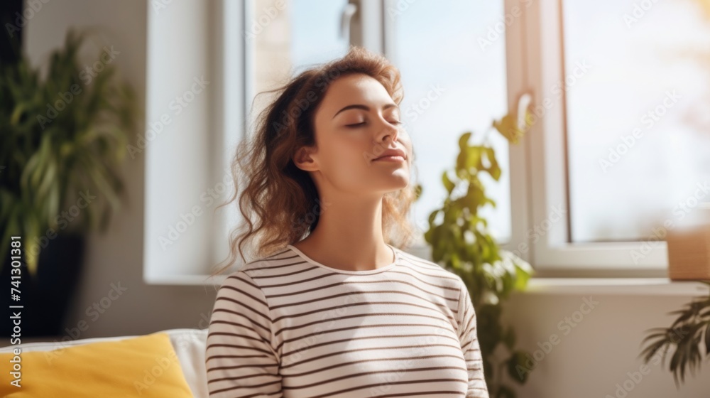 Happy young woman doing breathing exercise at home Happy young woman doing breathing exercise at home