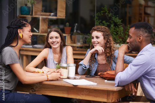 Friends, people relax at coffee shop and happy with reunion for bonding and conversation in Amsterdam. Social gathering at sidewalk cafe, trust and support with friendship date for connection