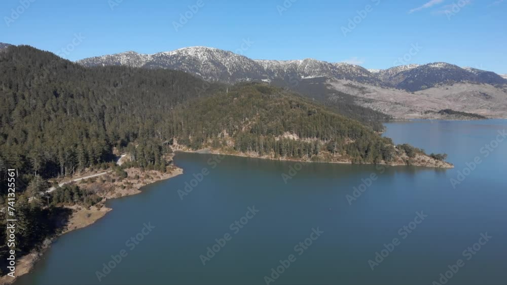 Ascending Drone view of Aoos spring lake flying high altitude Greece Ascending Drone view of Aoos spring lake flying high altitude Greece