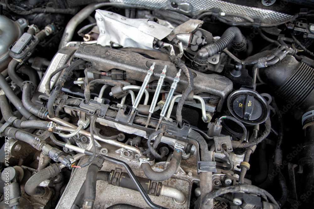 Modern ceramic glow plugs for diesel engines in cold weather in winter. Concept of breakdown and replacement of the heating element. Diesel engine preheater, industry Modern ceramic glow plugs for diesel engines in cold weather in winter. Concept of breakdown and replacement of the heating element. Diesel engine preheater, industry