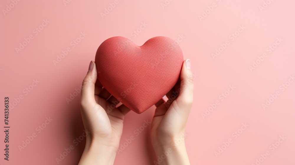 Fototapeta premium Hands holding decorative heart on white background, top view with space for text