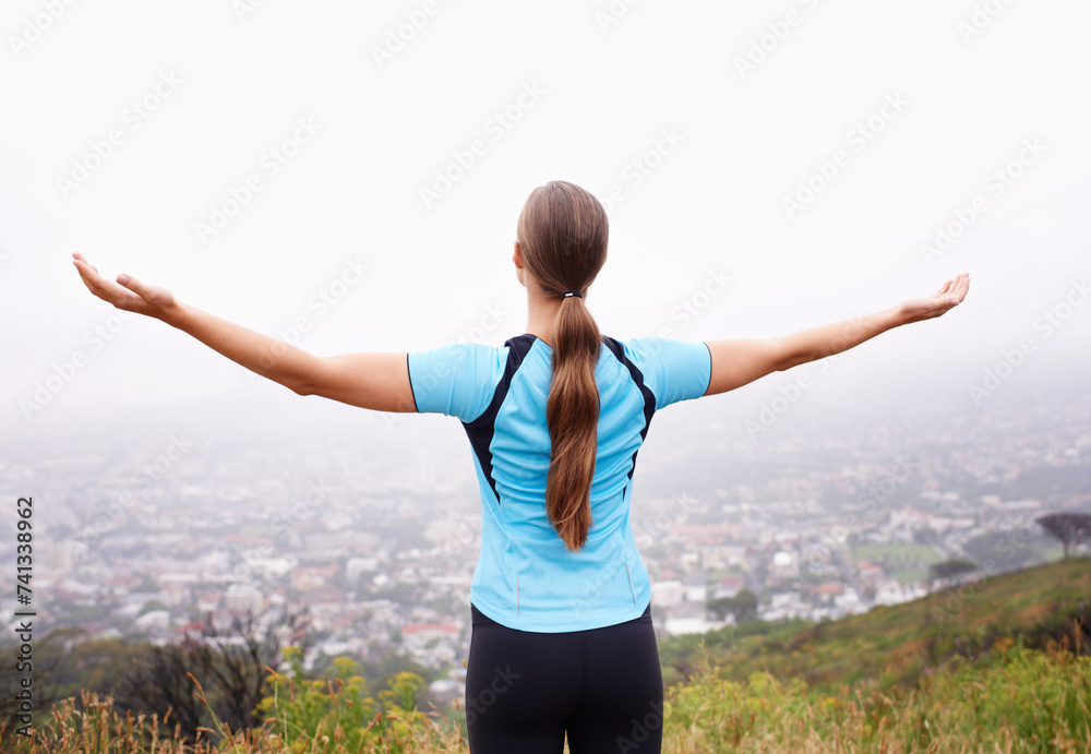 Fitness, freedom and sports with runner woman outdoor in mountains for cardio training or workout. Exercise, nature and view with athlete running in foggy morning for health or wellness from back Fitness, freedom and sports with runner woman outdoor in mountains for cardio training or workout. Exercise, nature and view with athlete running in foggy morning for health or wellness from back