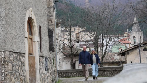 Scanno, Italy A tourist couple walk in the old town photo