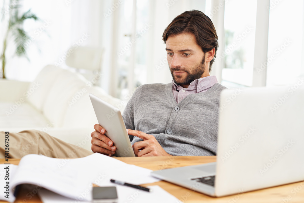 Journalist, man and home with laptop on tablet for research, online and information for newspaper article. Freelancer, remote work and living room to write for publication with news and report Journalist, man and home with laptop on tablet for research, online and information for newspaper article. Freelancer, remote work and living room to write for publication with news and report