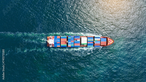 top view Cargo Container ship in the ocean ship carrying container and running for import export concept technology freight shipping by ship photo