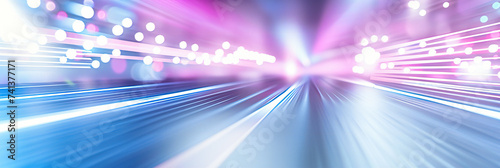 Speed and motion captured in a city at night, illustrating transportation and futuristic travel in a brightly lit tunnel