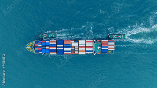 Cargo Container Ship running with with Tugboat. container ship import export to customers sea port. export shipping industry freight and transportation logistics concept.
