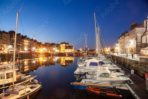 HONFLEUR, FRANCE - MAY4, 2018:Waterfront reflection of traditional houses in Honfleur, Normandy, France photo