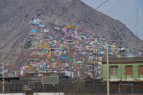 Poverty and crime make the colorful favelas of Lima, Peru a photogenic but dangerous place to experience the contrast in Peruvian society photo