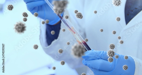 Image of floating macro Covid-19 cells over doctor taking sample and wearing medical gloves in lab