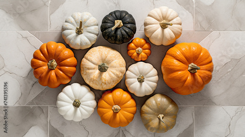 A group of pumpkins on a marble surface