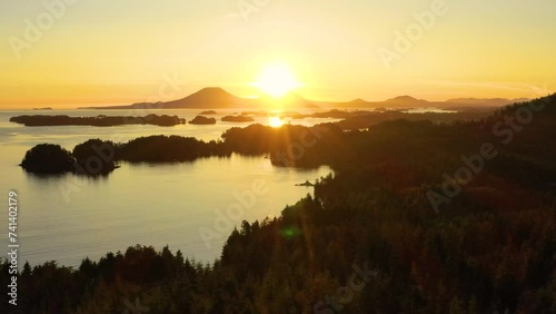 Aerial view of the setting sun over Sitka Sound and Mount Edgecumbe, Tongass National Forest, Baranof Island, Sitka, Alaska, United States. photo