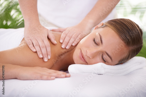 Spa, face and woman or hands with massage for relax, luxury treatment and satisfaction with towel. Person, calm and masseuse for body care, pain relief and comfort with smile, wellness and skincare
