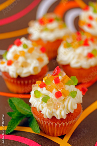 Cupcakes with candied fruit. photo