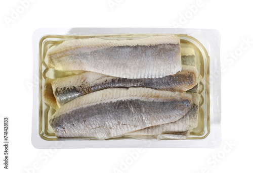 Raw herring fillet in oil in disposable plastic packing box. Isolated with clipping path.