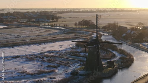 Windmill, 400 Years Old, Winter Snow, Haastrecht, Netherlands, Aerial Establishing Shot photo