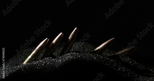 300 BLK Bullets Standing On Line In Smokeless Gunpowder. Close Up Shot photo