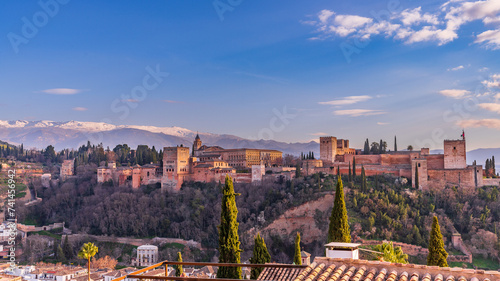 View of the Alhambra in Granada at sunset from the Mirador de San Nicolas, in Andalucia, Spain. photo