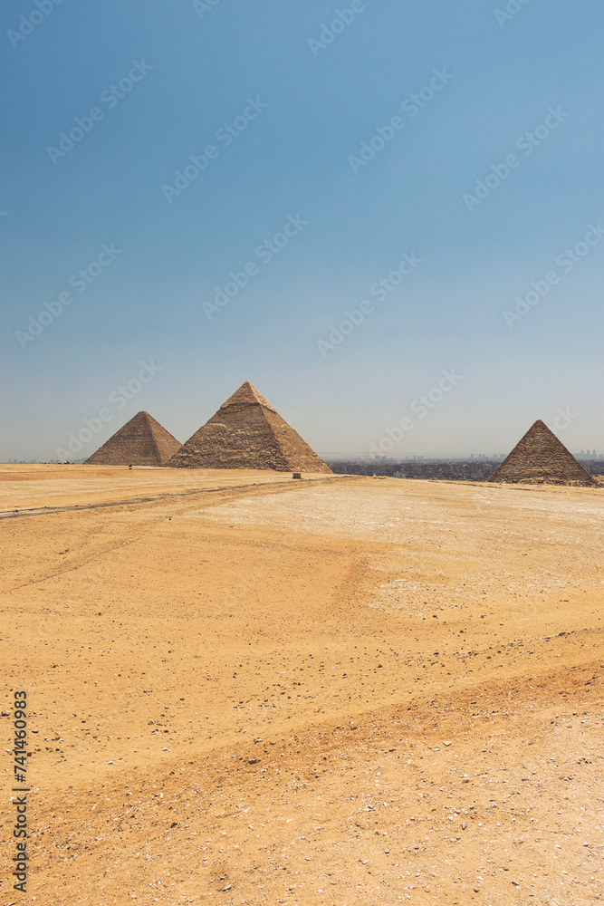 GIZA,EGYPT - JUNE 12 2023: Giza pyramid complex includes three pyramid complexes known as Pyramid of Khufu,Karfe and Menkaura and Egyptologists believe that they were built around 2560