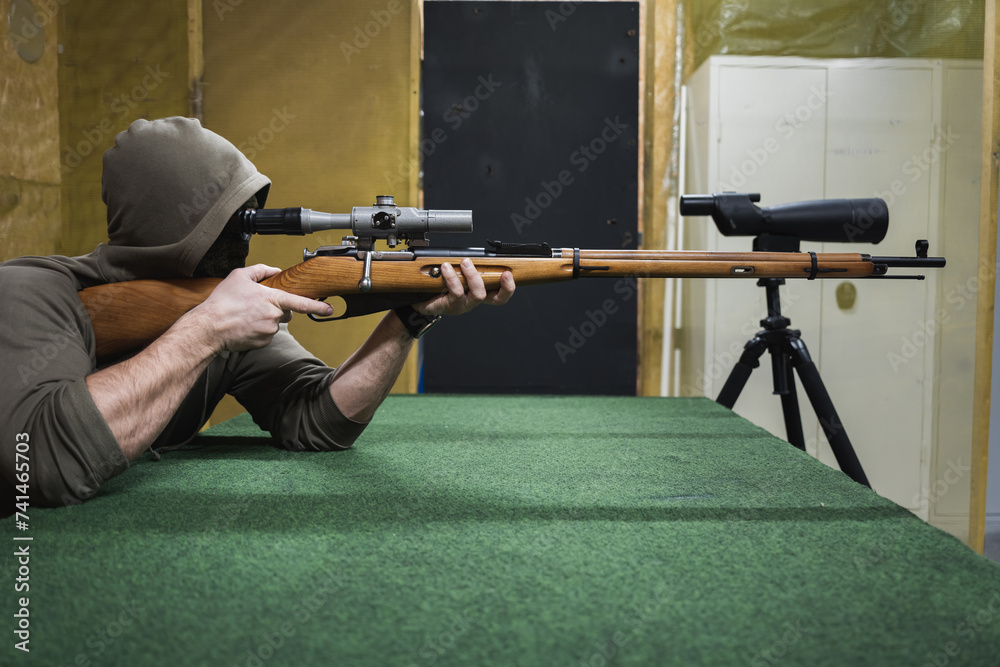 Sniper with old classic bolt action rifle at a shooting range. Stock ...