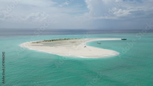Aerial drone view of a sandbank with anchored dhoni, a traditional Maldivian boat, Vashafaru, Haa Alif Atoll, Maldives.