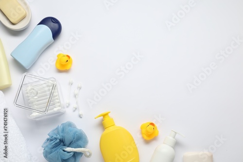 Baby bath accessories and care products on white background, flat lay. Space for text