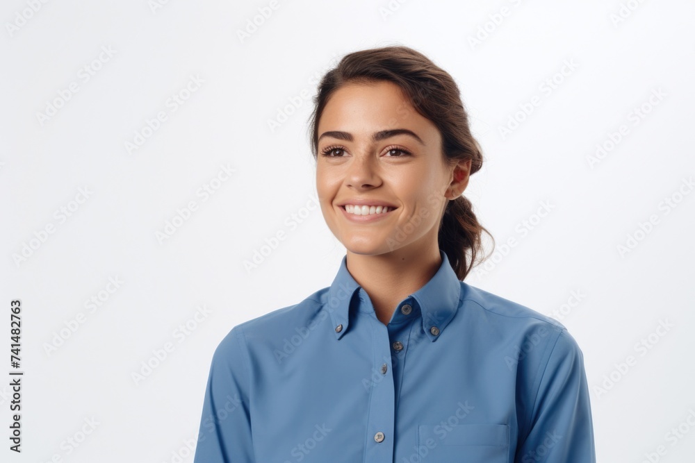 A woman in a blue shirt smiling at the camera. Suitable for various concepts A woman in a blue shirt smiling at the camera. Suitable for various concepts