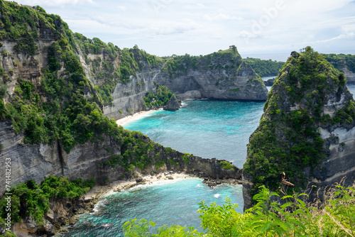 The cliffs of the small island Mountain Rocks at Diamond Beach on Nusa Penida Island near Bali seen from the top of the hill