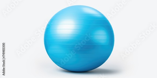 A blue exercise ball on a white surface. Perfect for fitness and health concepts
