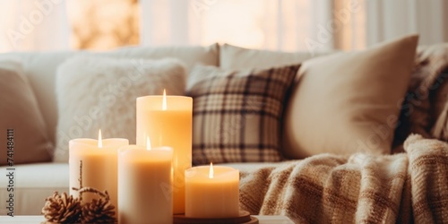 A simple and inviting coffee table setup with candles and a blanket  perfect for creating a warm and cozy atmosphere