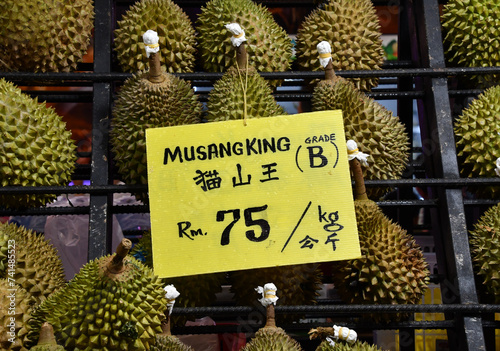 Canvas Print Delicious juicy fleshy aromatic Malaysian durians sold by fruit stalls in night market, Bukit Bintang, Kuala Lumpur, Malaysia