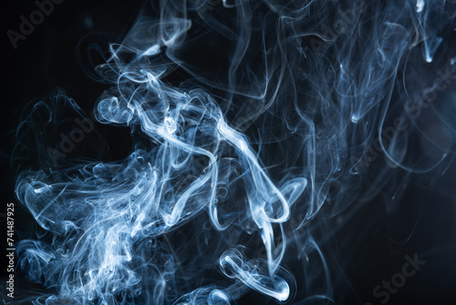 Photography Amidst the blackness, ethereal wisps of smoke ascend, weaving intricate patterns against the void