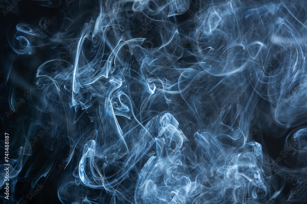 In the darkness, swirling wisps of smoke dance, painting mesmerizing images in the air. In the darkness, swirling wisps of smoke dance, painting mesmerizing images in the air.